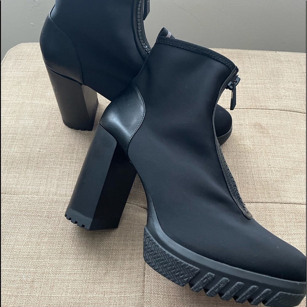 Brand new Black leather spandex zip up ankle boots.  Very comfortable.  4” heel.